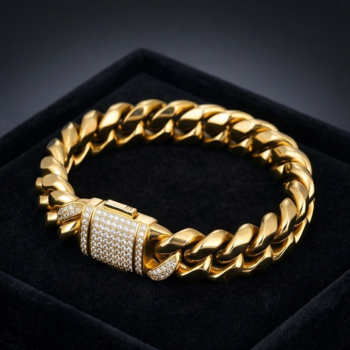 Gold chain bracelet with a clasp on a black background