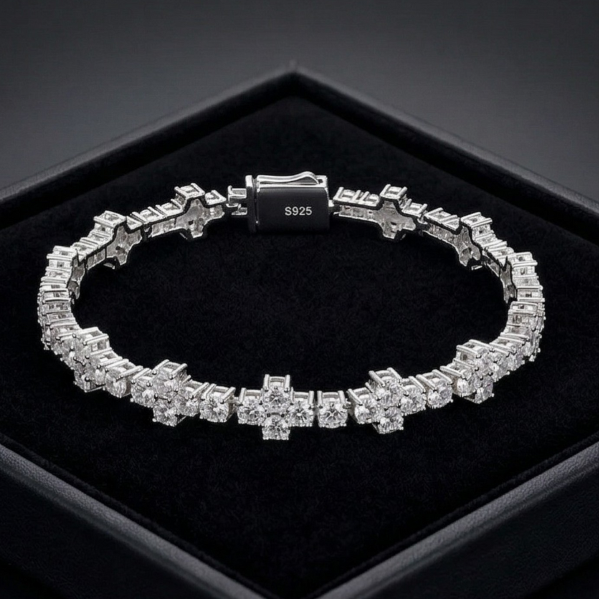 Silver bracelet with clear stones on a black background