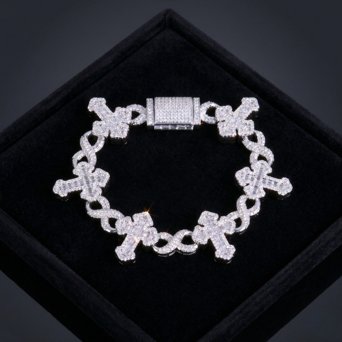 Silver chain bracelet with a clasp on a black background