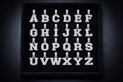Embroidered alphabet letters on a black background