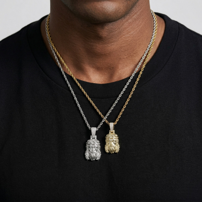 Two necklaces with pendants on a black shirt