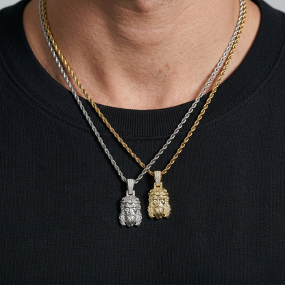 Two gold necklaces with pendants on a black background