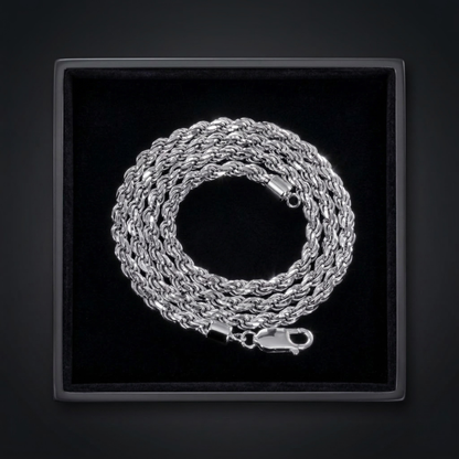 Silver chain necklace in a black jewelry box on a dark background
