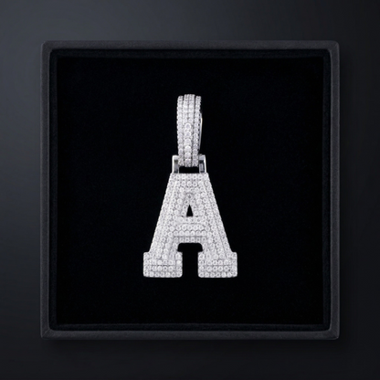 Diamond-studded letter 'A' pendant in a black box
