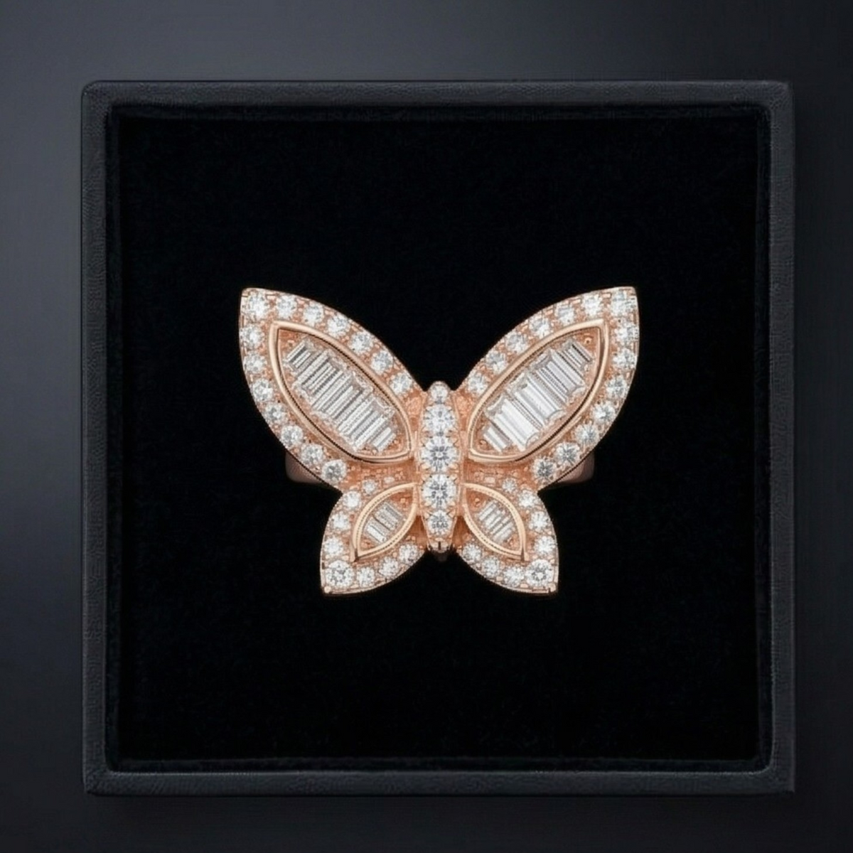 Butterfly-shaped jewelry piece with rose gold and gemstones on a black background
