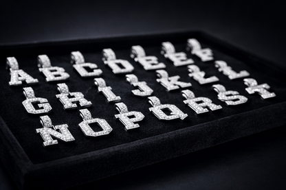 Alphabet letters on a black tray with a dark background